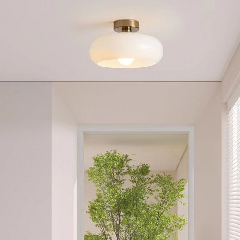 AmberSphere: Modern Round Ceiling Light with Warm Glass Shade